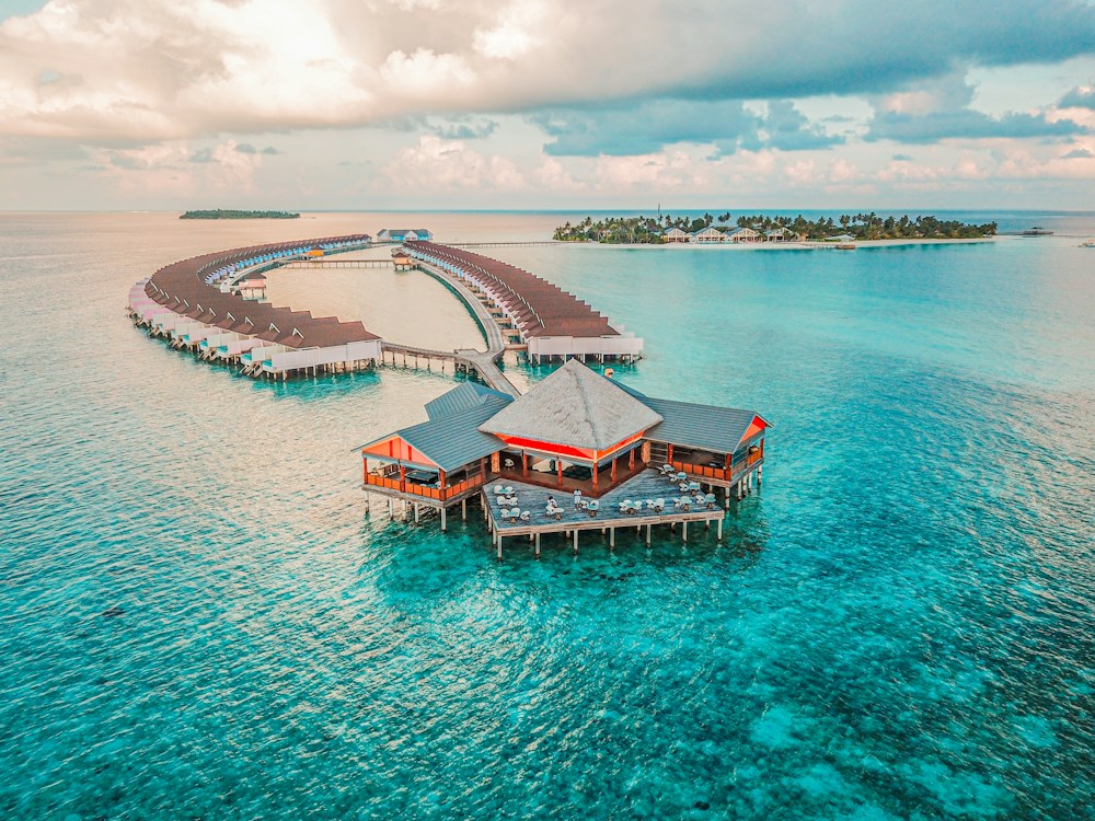 Overwater villas stretching across a Maldives lagoon